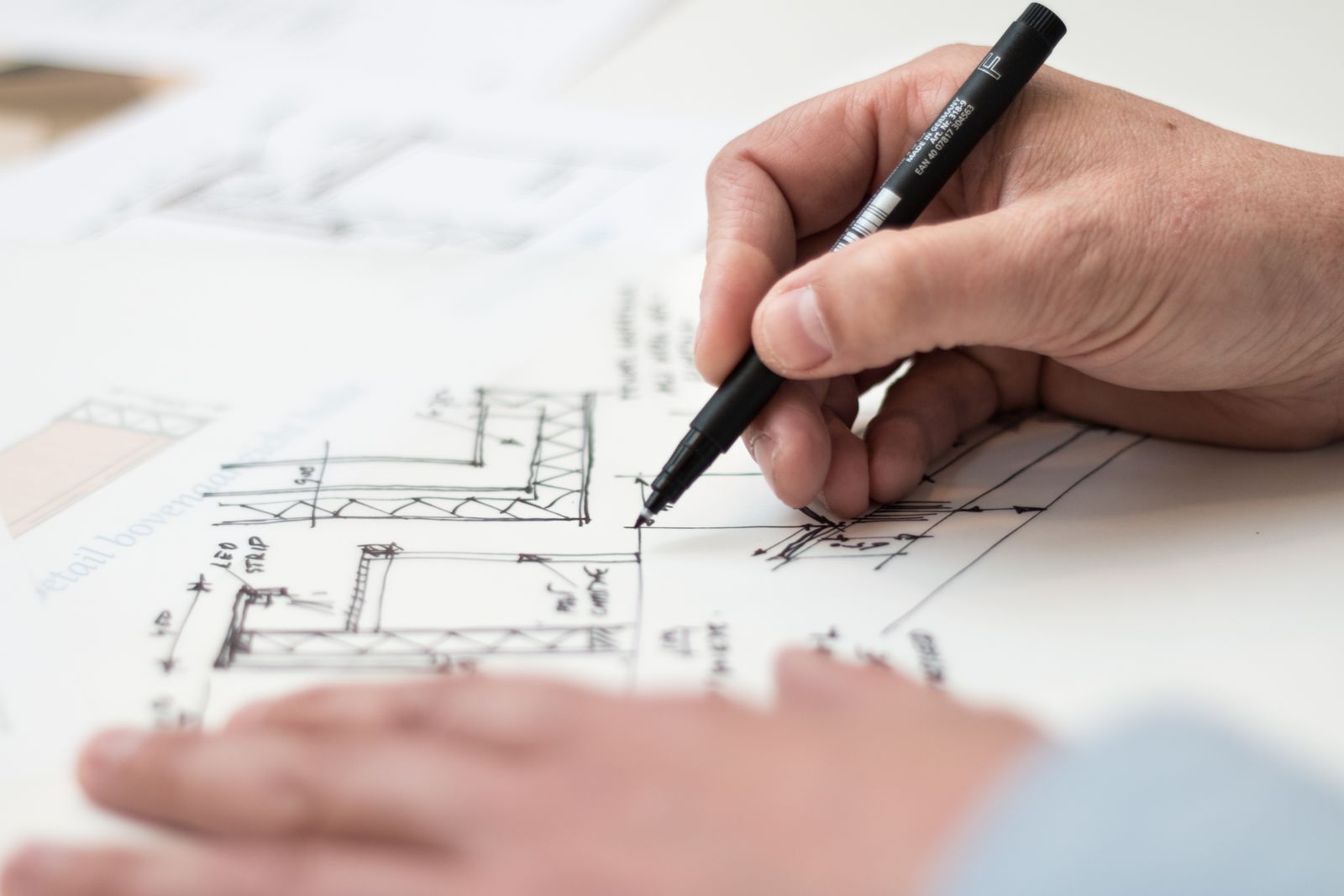 A hand drafting architectural plans