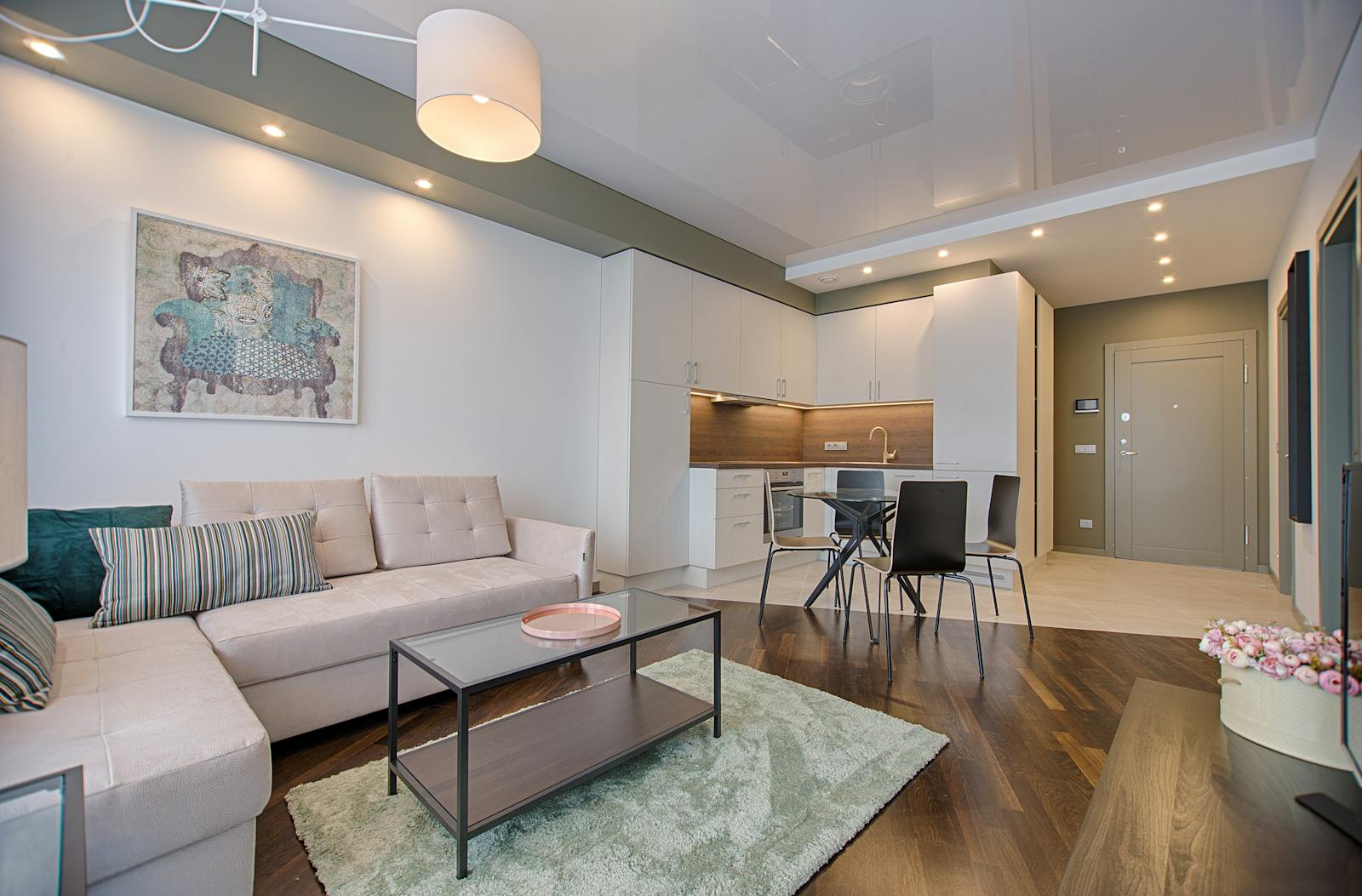 A bright renovated living room with warm neutral tones